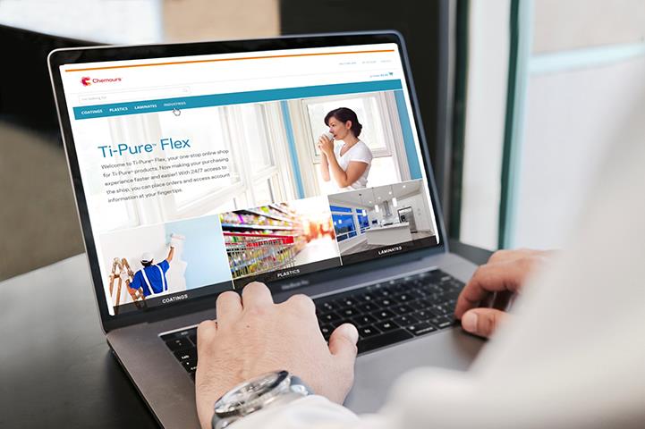 hands on a laptop with ti-pure flex content